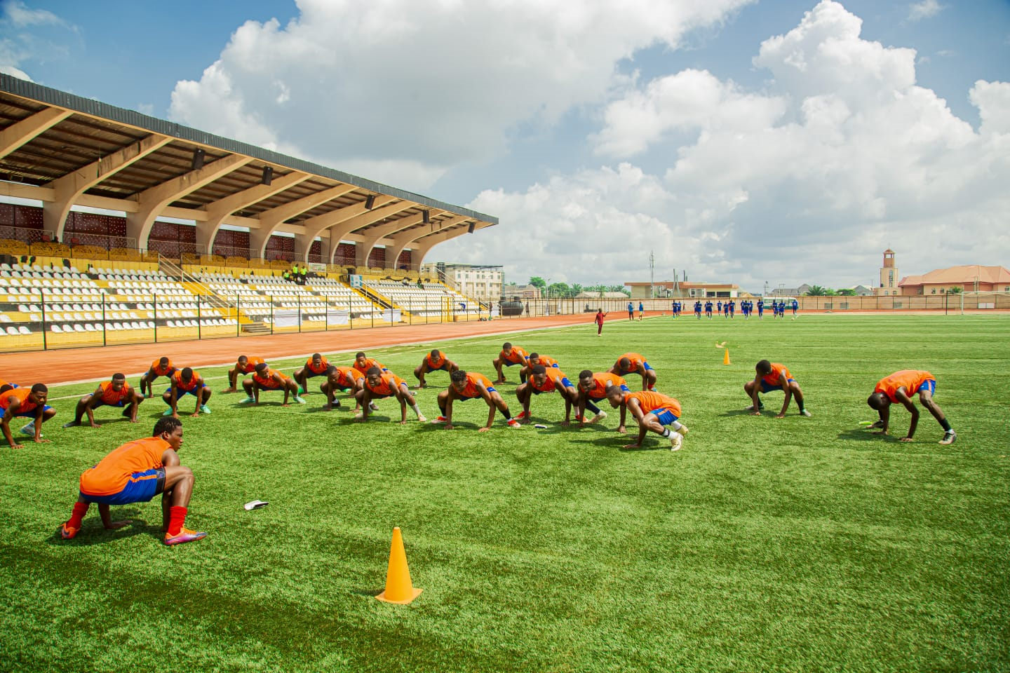 Team squatting during training